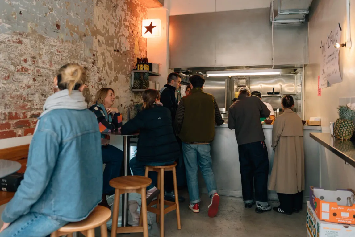 Guests ordering at the Super Taco counter